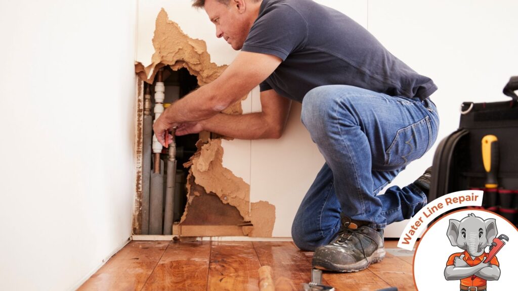 Man Repairing Burst Water Pipe