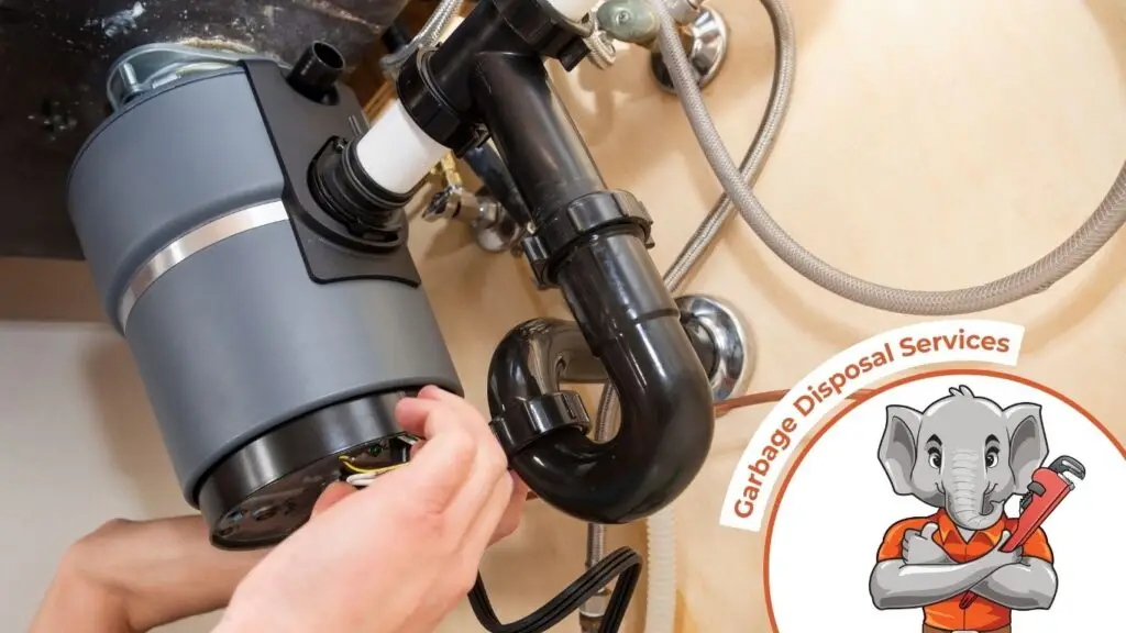 a technician performing garbage disposal repair